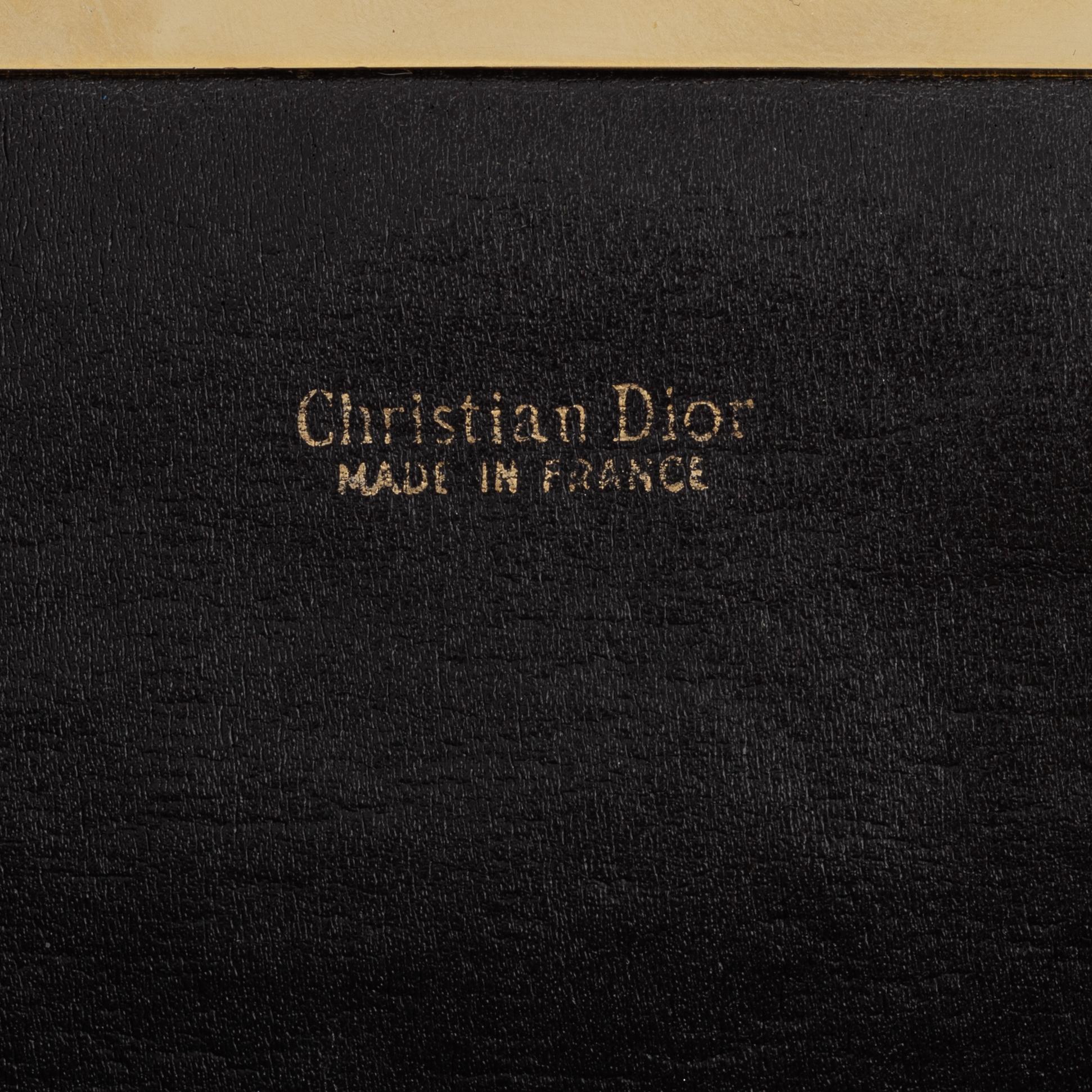 Christian Dior, a canvas clutch.