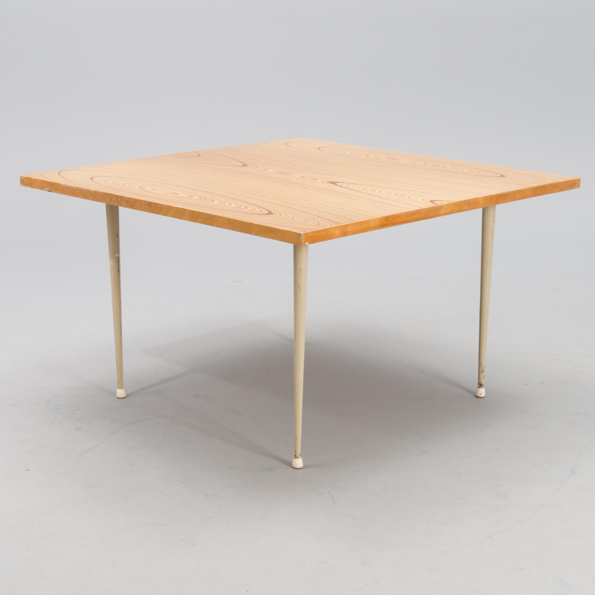 A coffee table marked Tapio Wirkkala, Asko, Made in Finland.