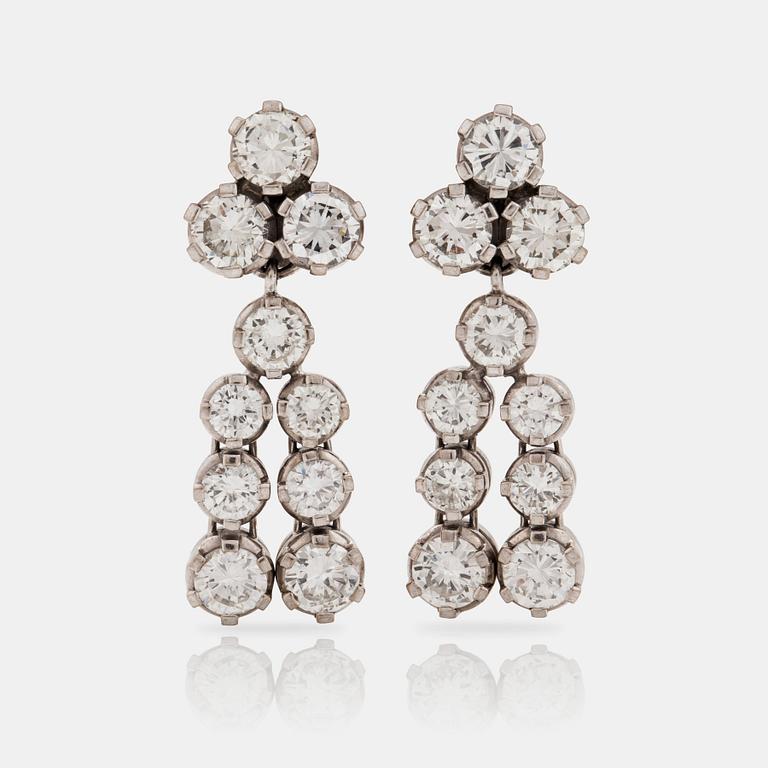 A pair of brilliant cut diamond earrings. Total carat weight circa 7.35 cts.