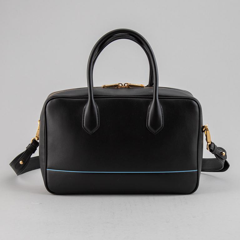 PRADA, a leather bag.