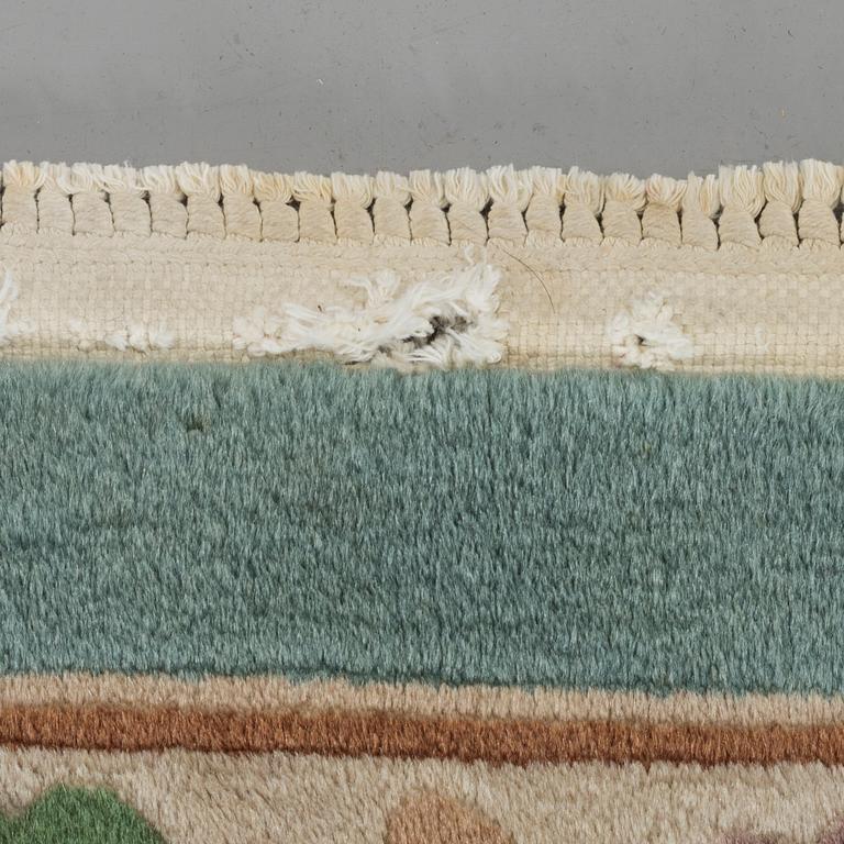 An old Chinese carpet ca 335 x 243 cm.