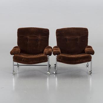 TWO 1970`S ARMCHAIRS.