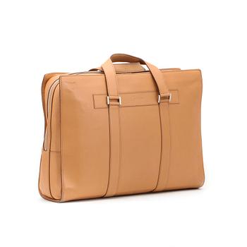 CARTIER, a beige leather briefcase.