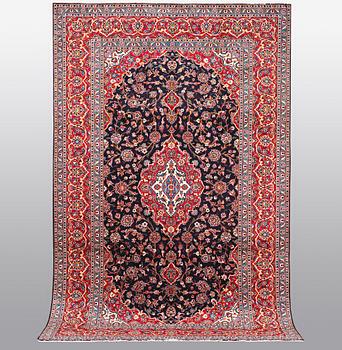 A carpet, Kashan signed Najafi, ca 360 x 231 cm.