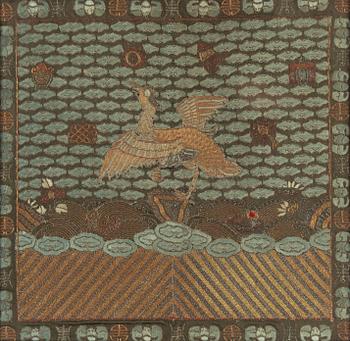 An embroidered civil official's rank badge with a bird, 'buzi', Qing dynasty.