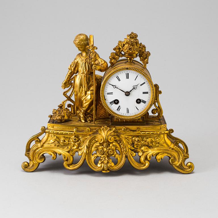 A LATE 19TH CENTURY GILT METAL MANTLE CLOCK in the Rococo style.