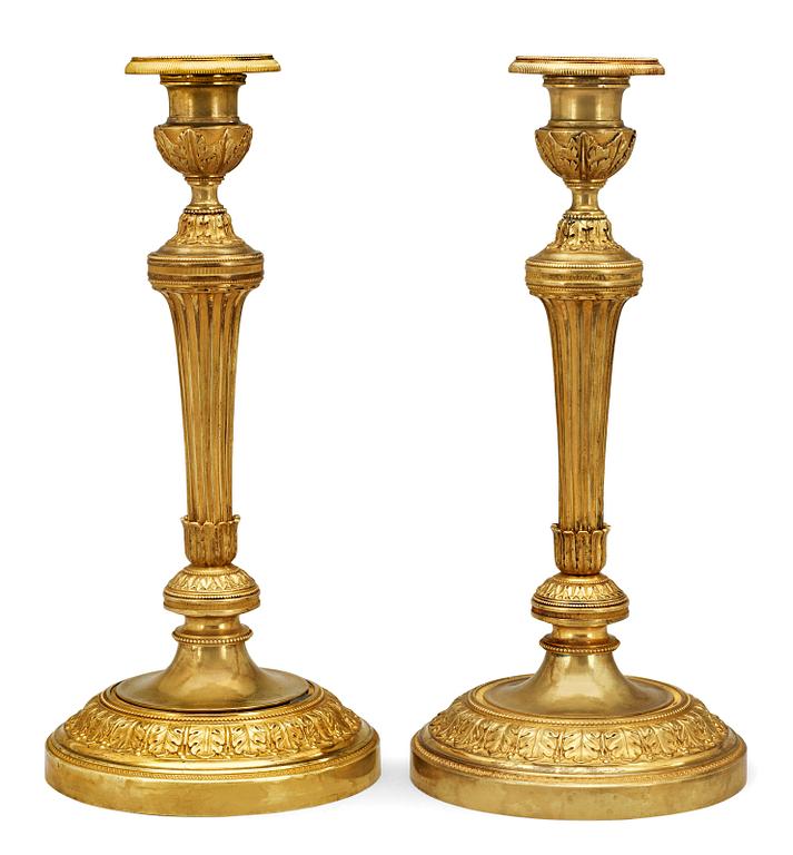 A pair of French Empire early 19th Century candlesticks.