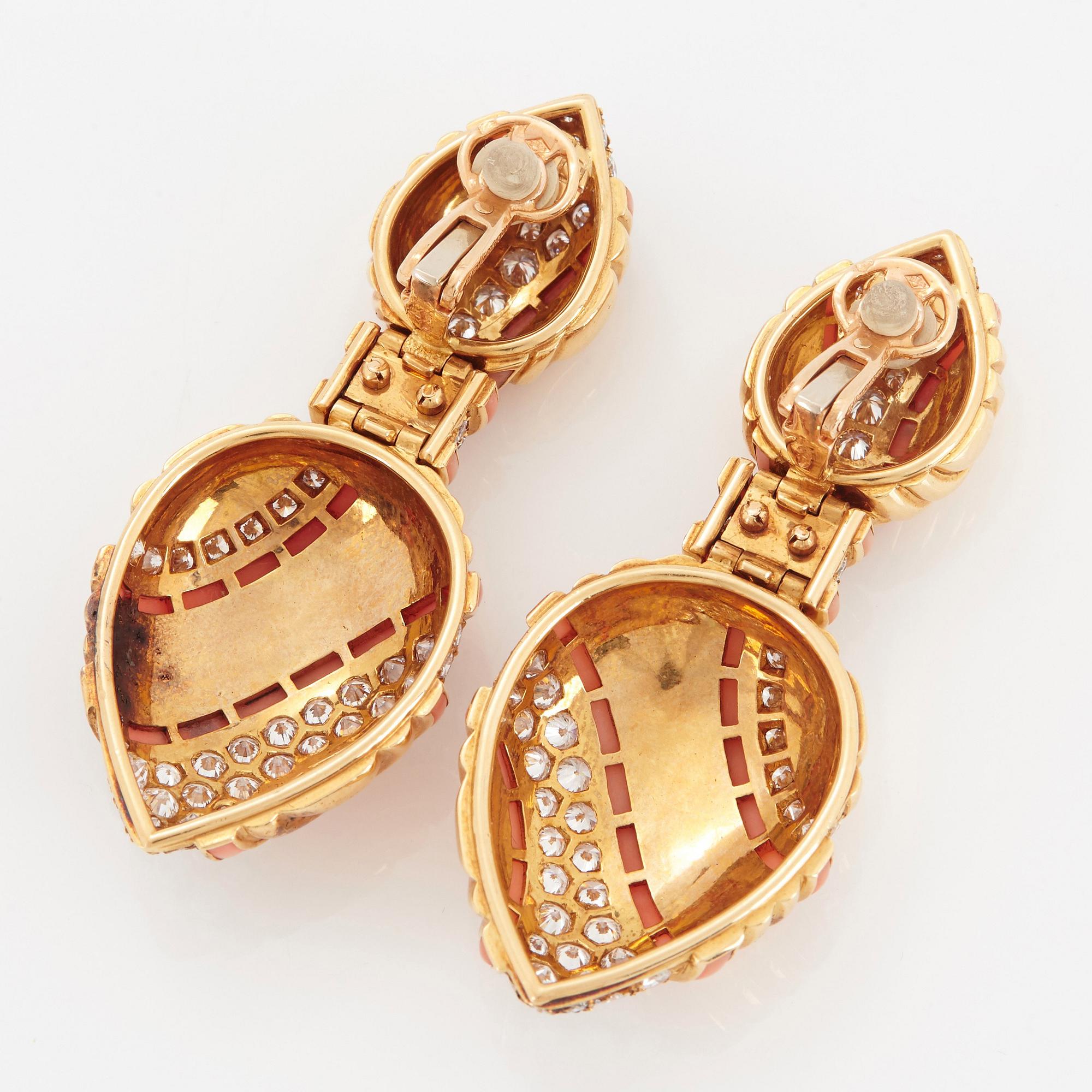 A pair of 18K gold Boucheron earrings set with round brilliant-cut diamonds and coral.