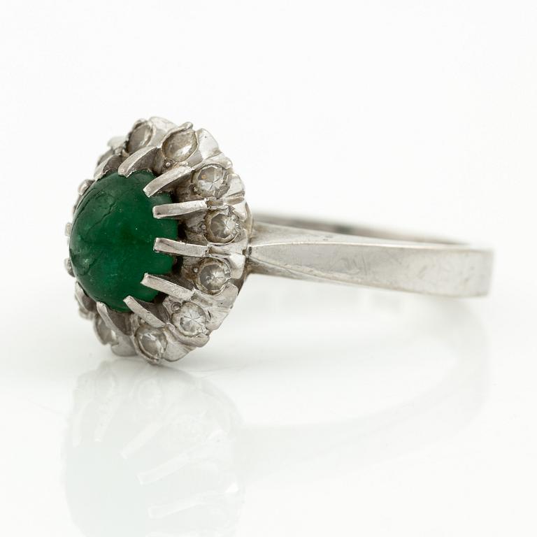 Ring, 18K white gold with cabochon-cut emerald and brilliant-cut diamonds.