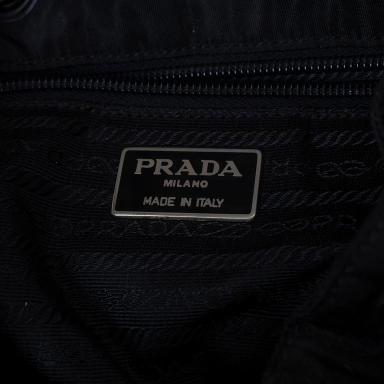 Prada, A nylon and leather backpack.