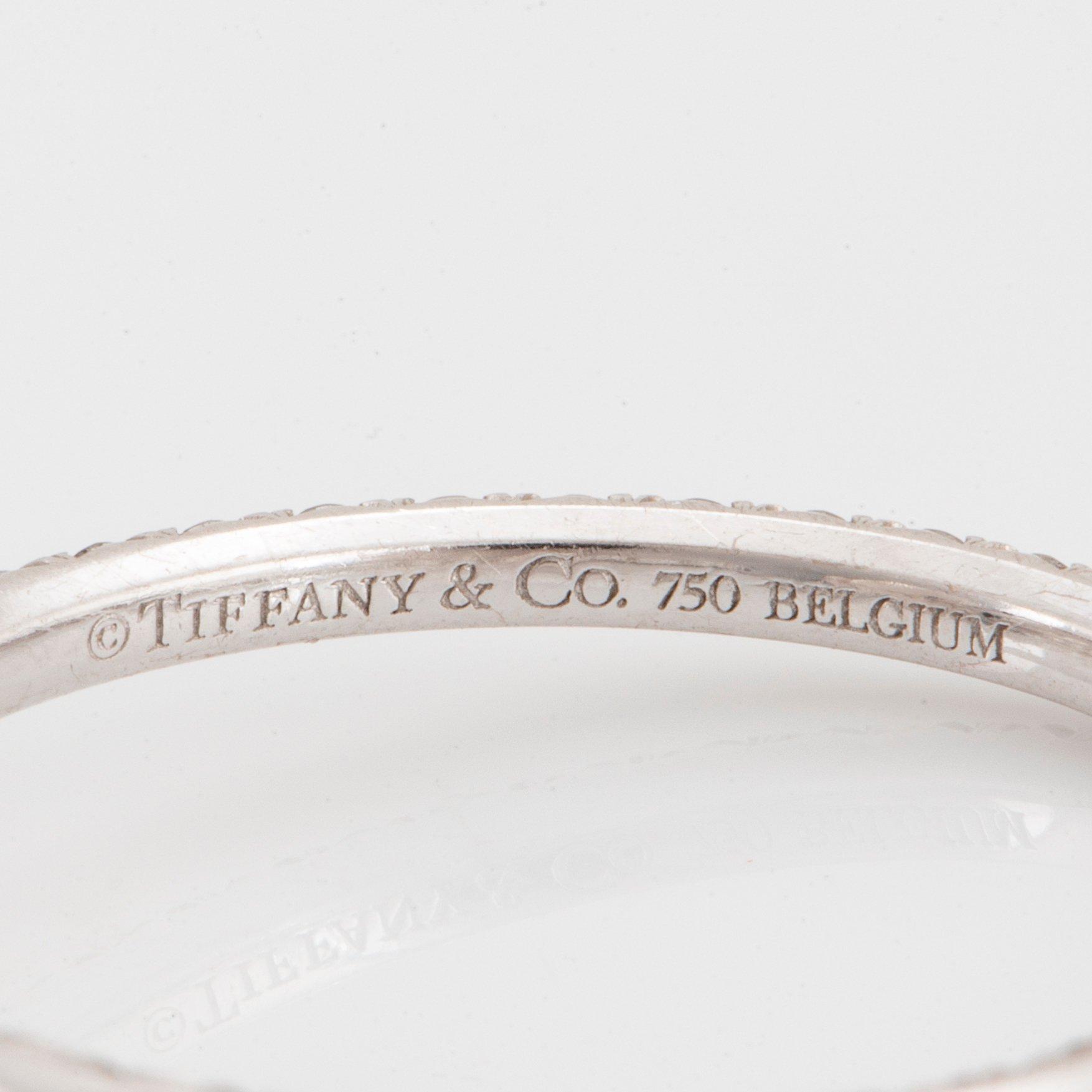 A pair of Tiffany "Metro" 18K white gold hoops set with round brilliant-cut diamonds.