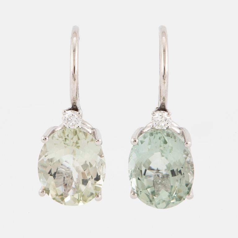 Light-green tourmaline and brilliant-cut diamond earrings.