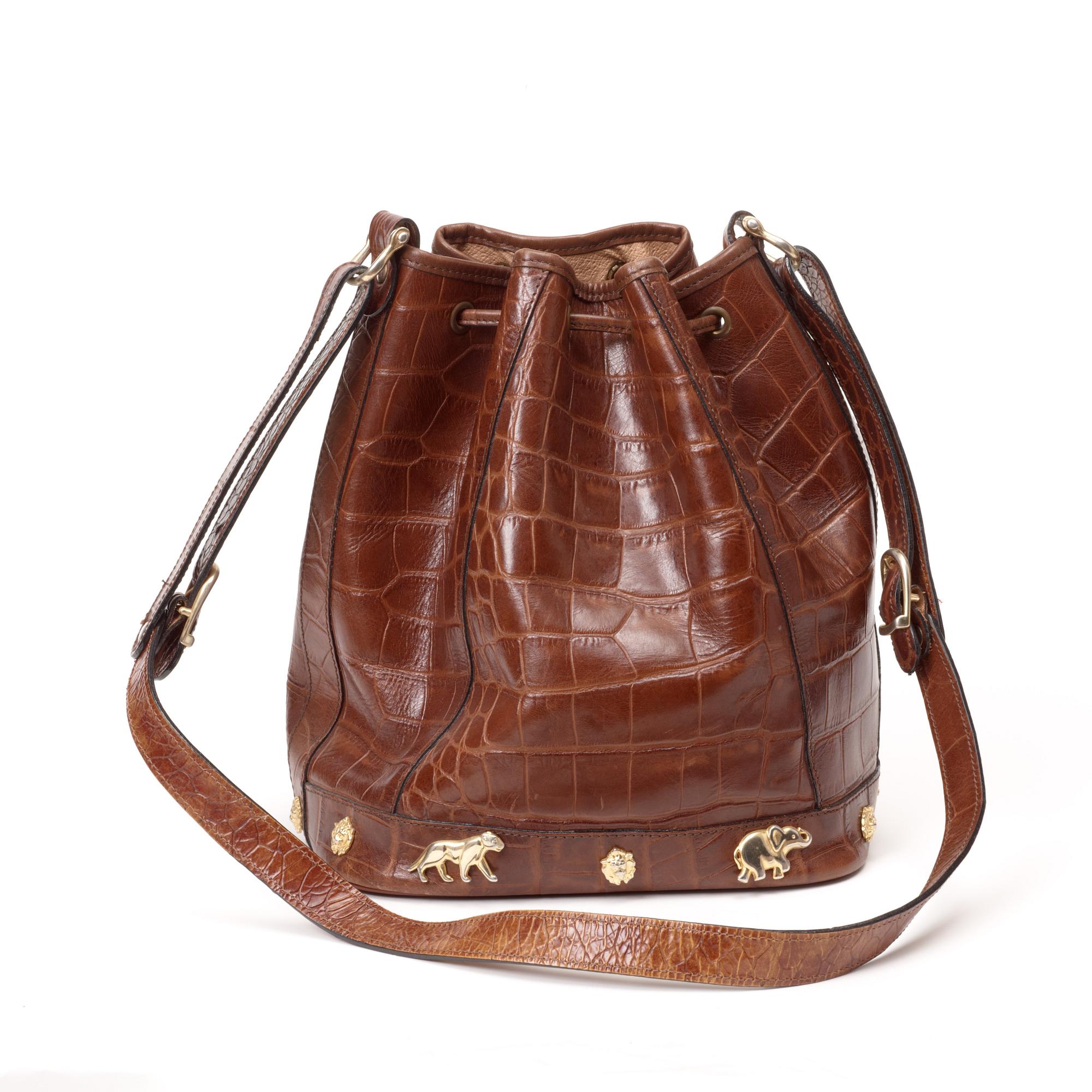 A brown crocodile embossed leather shoulder bag.