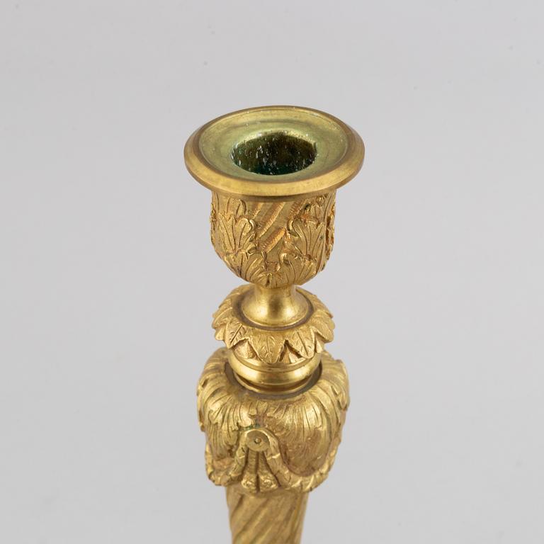 A pair of bronze Louis XV-style candlesticks, circa 1900.