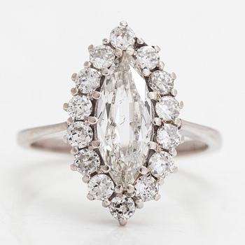 An 18K white gold ring with a central marquise-cut diamond ca. 1.40 ct and  brilliant-cut diamonds ca. 0.70 ct in total.