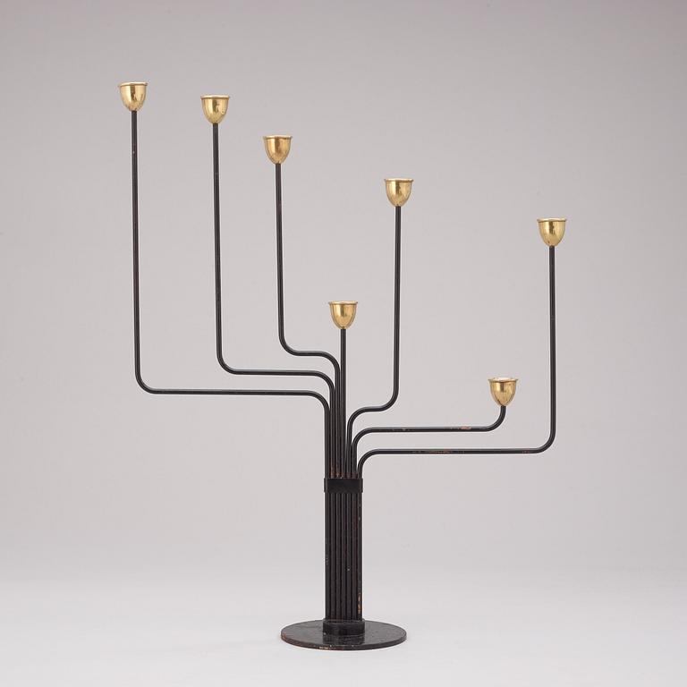 A Piet Hein brass and black lacquered metal candelabrum, 1950's-60's.