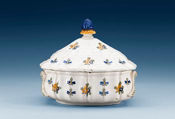 427. A French faience tureen with cover, 18th Century.