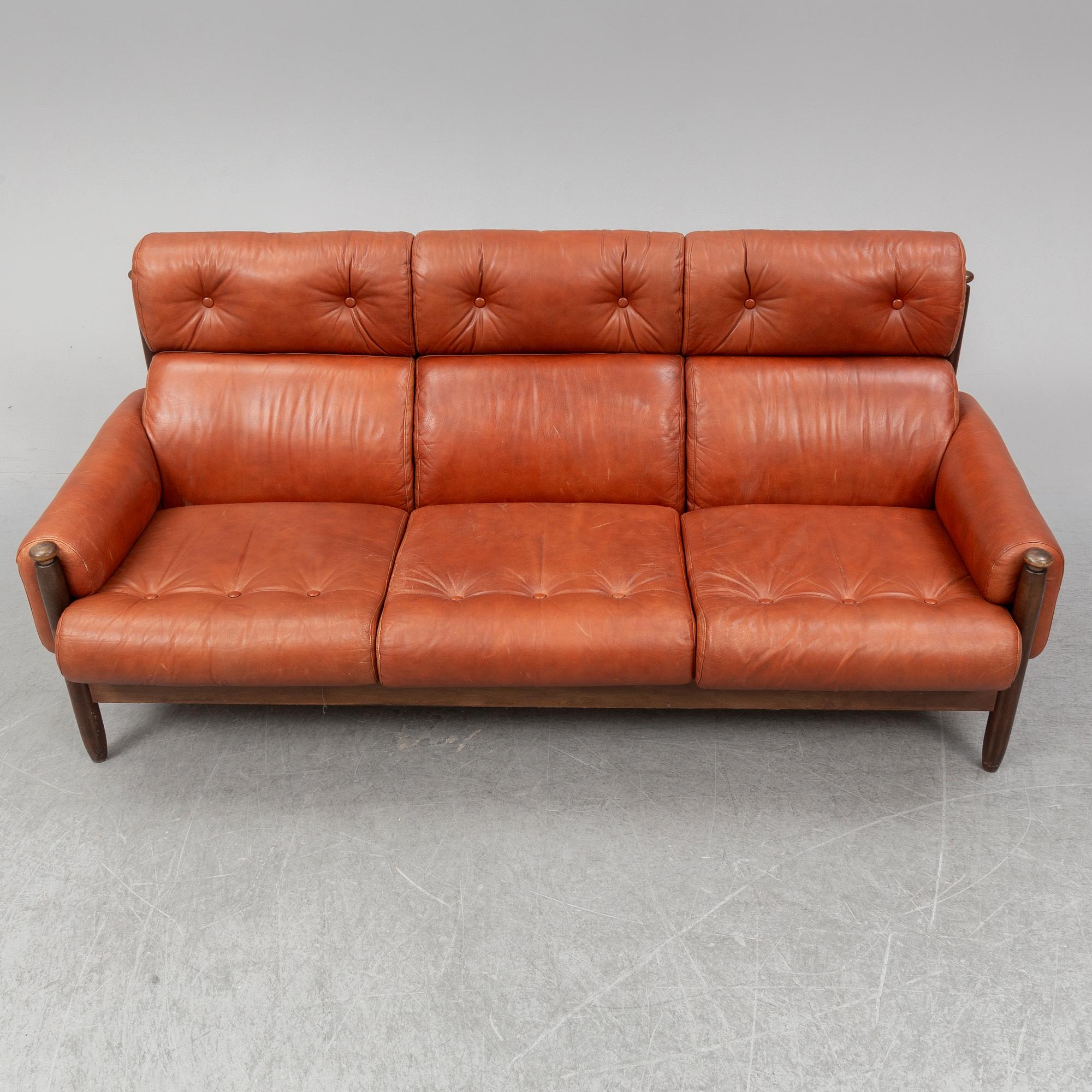 A 1960's/70's three-piece furniture suite.