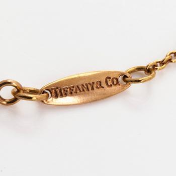 Tiffany & Co, Elsa Peretti, an 18K gold bracelet, 'Diamonds by the Yard', with a diamond approximately 0.08 ct.