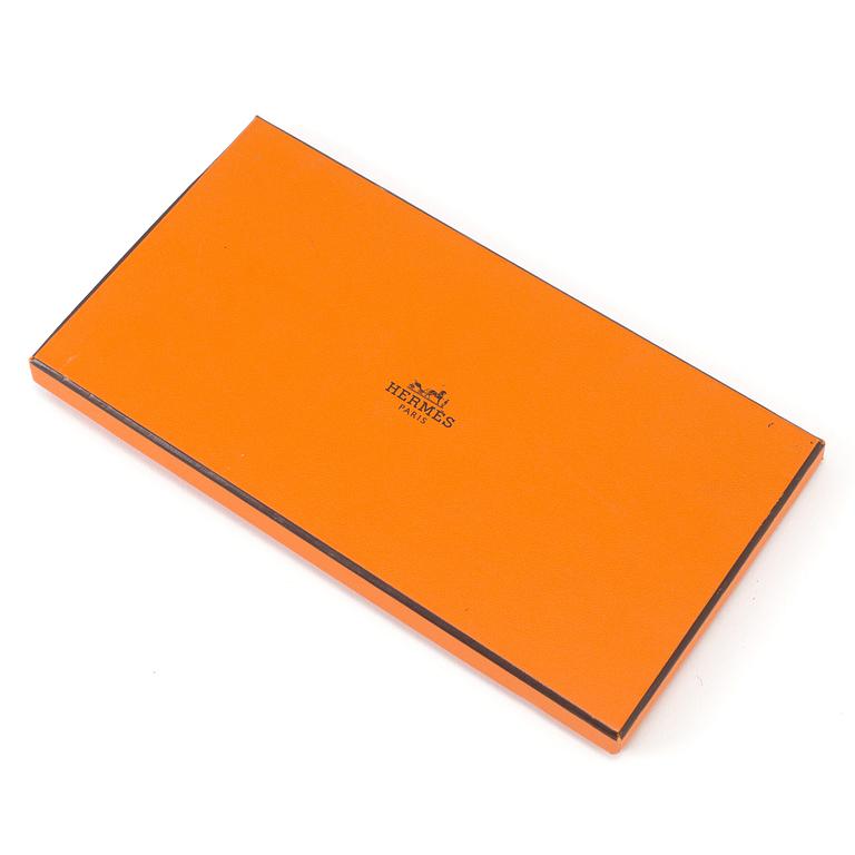 Wallet by Hermès.