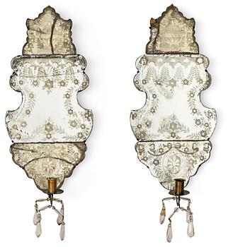 999. A pair of Baroque one-light girandole mirrors.