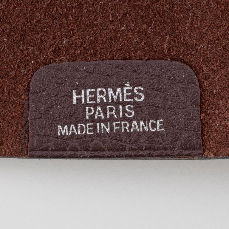 HERMÈS, a brown leather notebook, "Ulysse Petit Modèle".