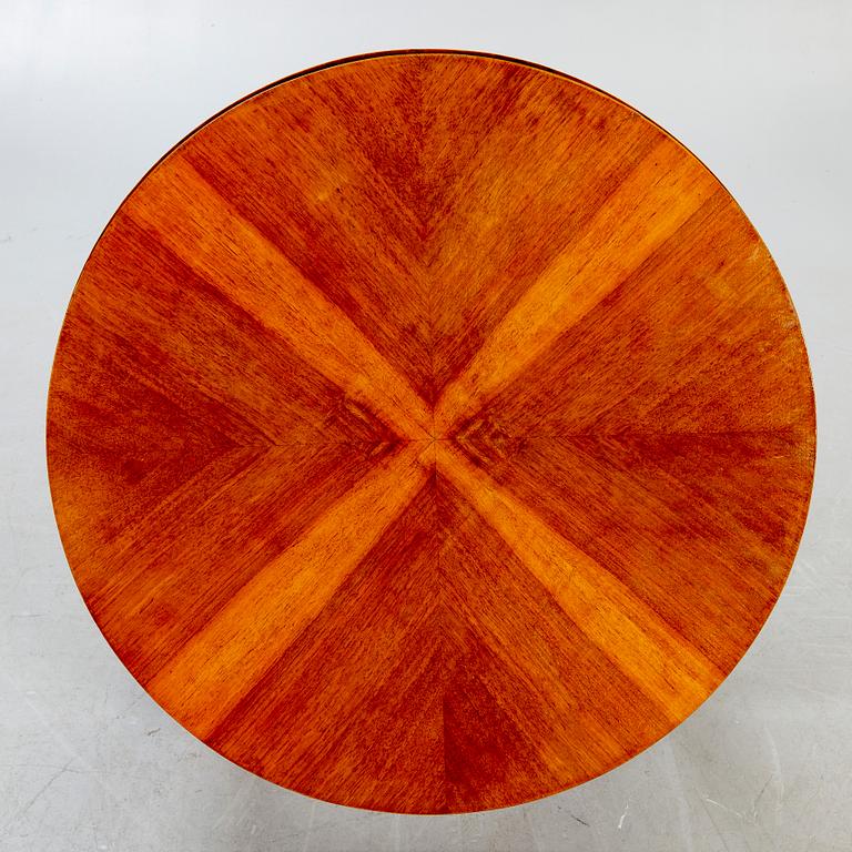 An Art deco style walnut coffee table alter part of the 19th century.