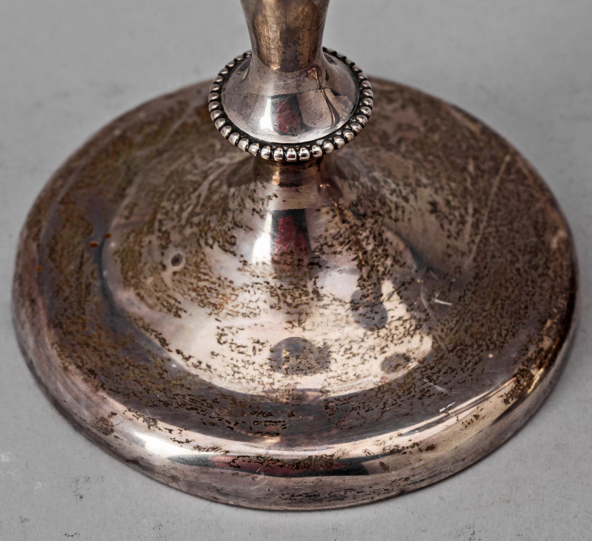 LJUSSTAKAR, ett par, sterling, märkta Hyman, Berg & Co, Chicago, USA, 1900-tal. Vikt ca 498 g.