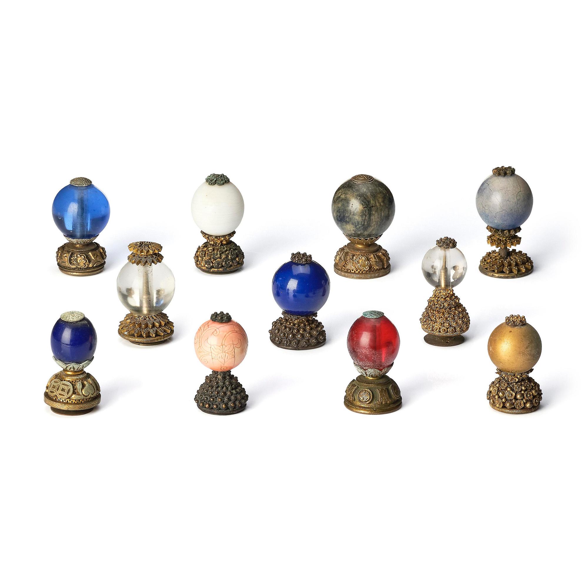 A group of 11 various 'official's hat' finials, Qing dynasty, 19th century.