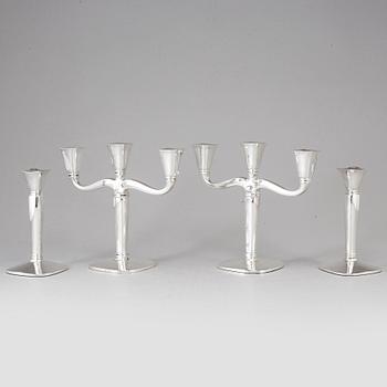 Four (2+2) silver candle holders and candelabras, Germany, 20th century.