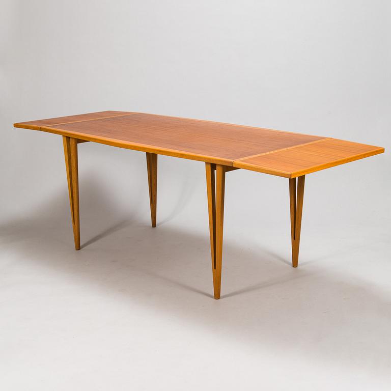 A mid-20th century dining table.