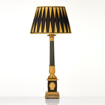 A French late Empire ormolu and patinated bronze lamp, first part 19th century.