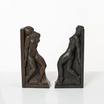 Axel Gute, two patinated metal bookends.
