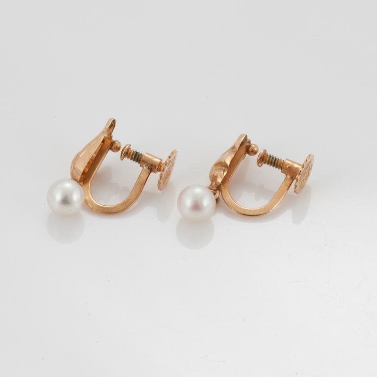 A pair of earrings set with cultured pearls.