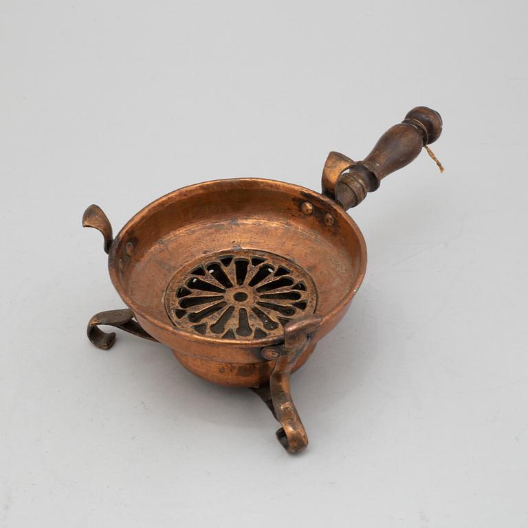 An 18th century copper firepan.