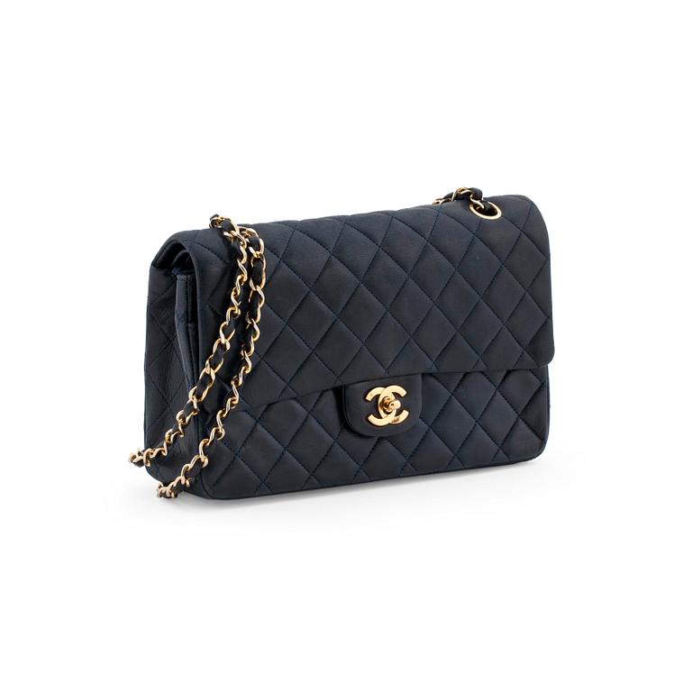 CHANEL, a quilted blue leather "Double Flap" shoulder bag.