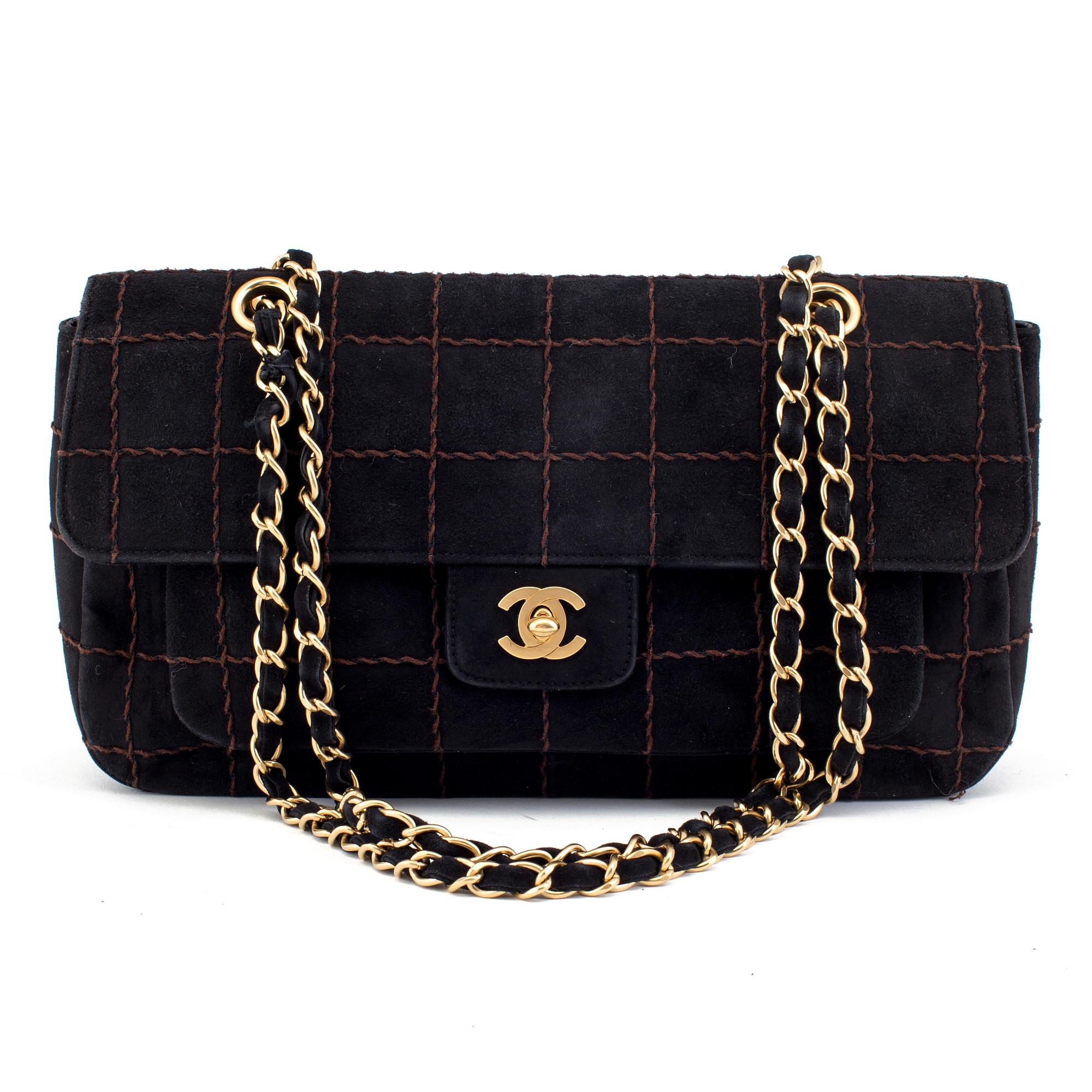 A CHOCO BAR SUEDE FLAP BAG BY CHANEL.