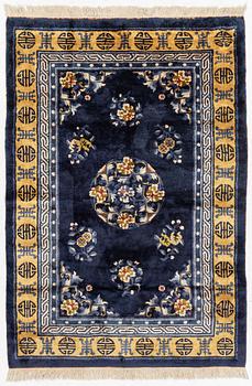 A semi-antique silk Chinaese 'Antique finish' rug, c. 175 x 122 cm.