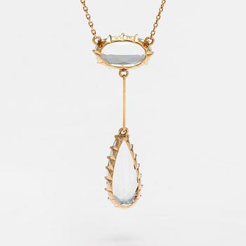 An 18K gold necklace with aquamarines.