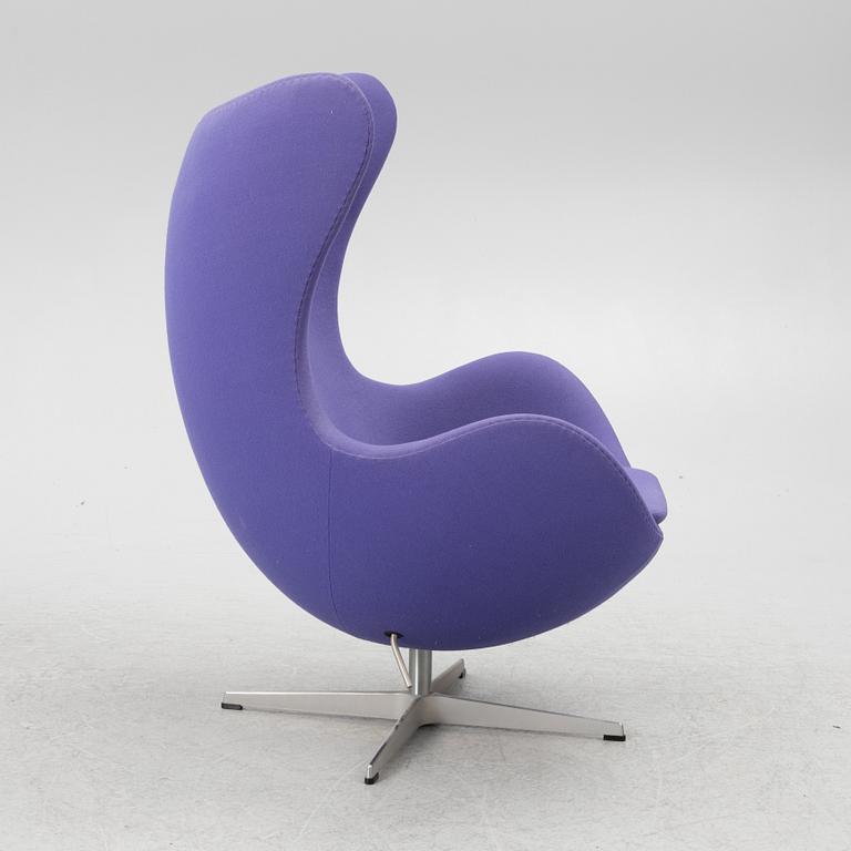 Arne Jacobsen, an armchair with footstool, "The Egg", Fritz Hansen, Denmark, 2003.