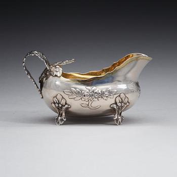 A Swedish 18th century parcel-gilt cream-jug, m arks of Anders Schotte, Uddevalla 1784.