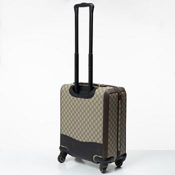 Gucci, suitcase / cabin bag.