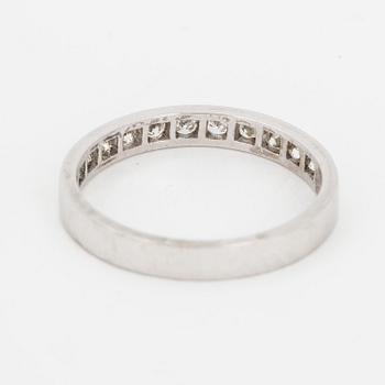 Brilliant-cut diamond half-eternity ring.