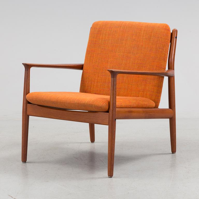 A 1960s teak Grete Jalk armchair from Glostrup, Denmark.