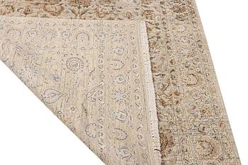 An Ushak Design, silk rug, a. 242 x 170 cm.