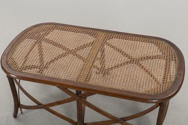 A wooden sofa, a table and four chairs, later part of the 20th century.