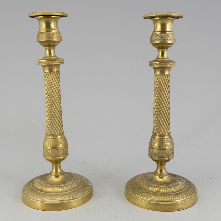 A pair of 'Empire' candlesticks, probably French.