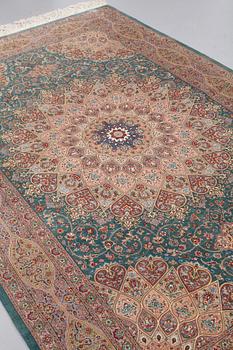 A CARPET, Old silk Qum, signed Moghadam, ca 309,5 x 190,5 - 193 cm.