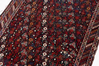 An antique Qashgai rug, 230 x 135 cm.