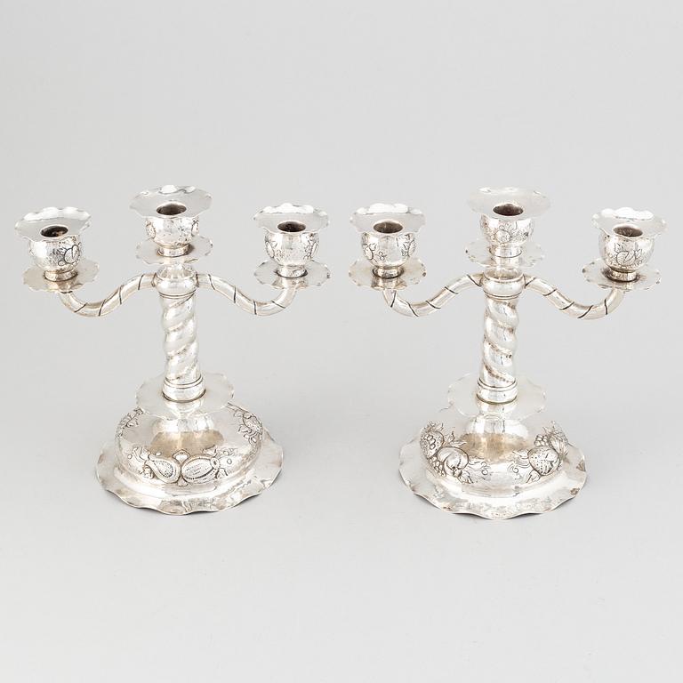 A pair of Swedish baroque-style silver candelabra, mark of CG Hallberg, Stockholm 1926.